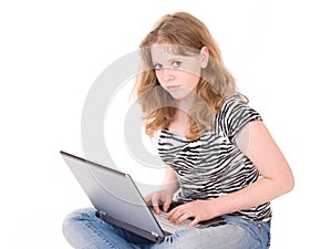 Teenager girl working on laptop