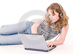 Teenager girl working on laptop