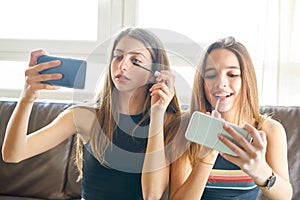 Teenager girls best friends makeup selfie camera