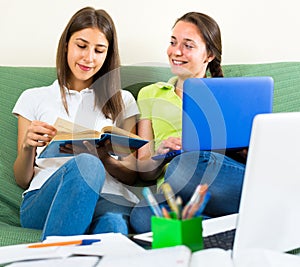 Teenager girls studying at home