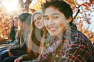 Teenager, group and portrait in park, boy and together on holiday, nature and relax by trees. Youth culture, happy