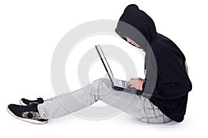 Teenager hacker with laptop