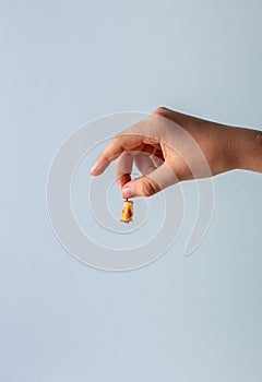 Teenager hand with small haw stump in fingers