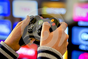 Playing video games on Xbox console, TV background photo