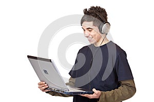 Teenager with headset downloads internet music