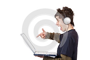 Teenager with headset points at computer