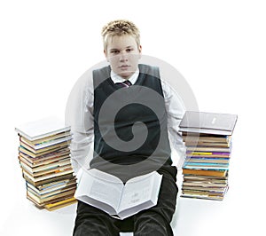 Teenager with a heap of textbooks. Was tired of homeworks.