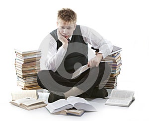 Teenager with a heap of textbooks. Was tired of homeworks.