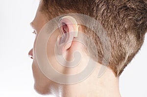 Teenager with hearing aid