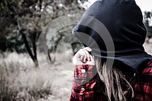 Teenager hiding her face from the camera