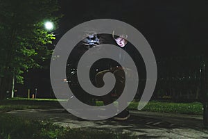 Teenager on his cellphone at night.