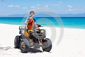 Kids on quad bike. Off road all terrain vehicle