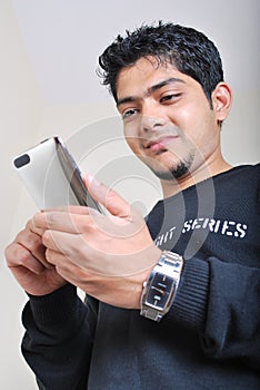 Teenager with an ipod touch photo