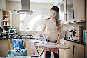 Teenager Ironing Laundry