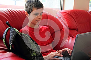 Teenager using a laptop