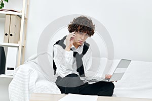 teenager laptop sitting on white sofa online training Lifestyle technology