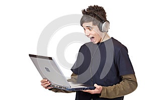 Teenager listen to mp3 digital music at computer