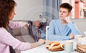 Teenager listening to reprimanding mother