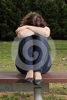 Teenager lonely depressed and sadness in a park
