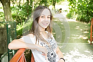 Teenager long hairs girl in garden park summer