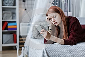 Teenager looking at phone