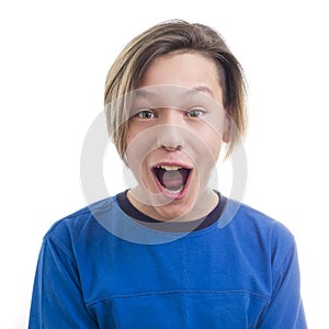 Teenager making faces on white background close-up