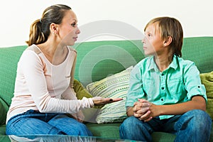 Teenager and mother having serious talking