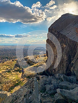 Teenager mountain biking on Table Rock in Boise, Idaho