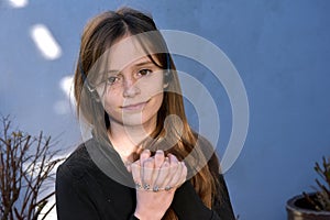 Teenager with painted fingernails and headphones