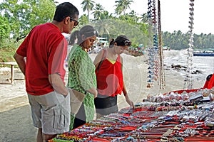 Teenager and Parents Shopping in Flea Market