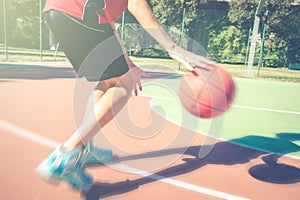 Teenager play basketball outdoor healthy sporty teenagers lifestyle concept in spring or summer time