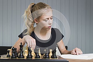 Teenager play chess