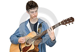 Teenager playing acoustic guitar