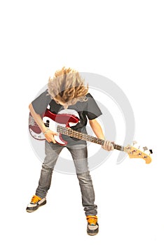 Teenager playing bass guitar
