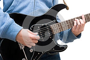 Teenager playing electric guitar