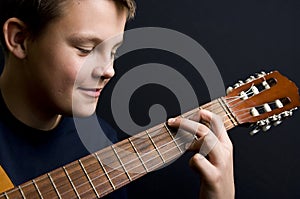 Teenager playing guitar