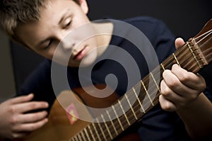 Teenager playing guitar