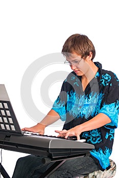 Teenager playing a keyboard