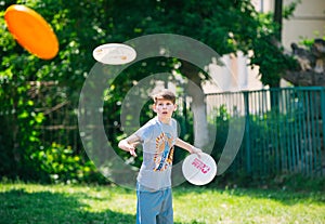Teenager playing in the park with a plate