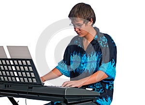 Teenager plays classical music on a keyboard