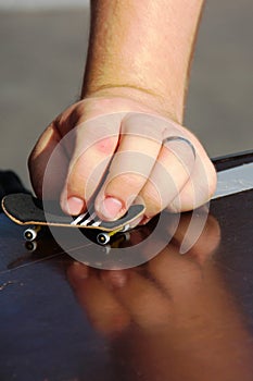 teenager plays the fretboard close-up. competitions in vulture, freestyle and hurdles. home games in quarantine