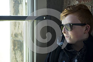 Teenager posing wearing sunglasses