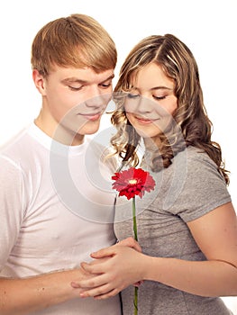 Teenager preset his girlfriend flower. Valentine day.