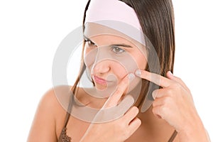Teenager problem skin care - squeeze pimple photo