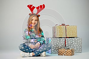 Teenager with red horns bought Christmas gifts for parents at low price.The girl is waiting when she can present