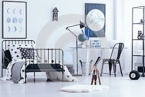 Teenager`s bedroom interior with telescope