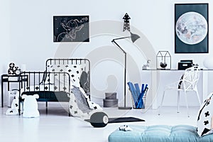 Teenager`s bedroom with moon poster