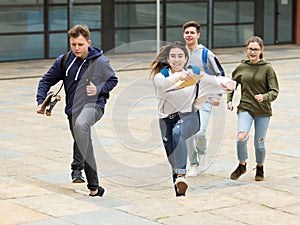 Teenager school kids running