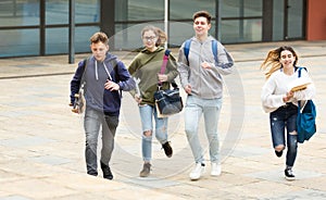 Teenager school kids running