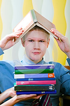 Teenager schoolboy was tired from lessons